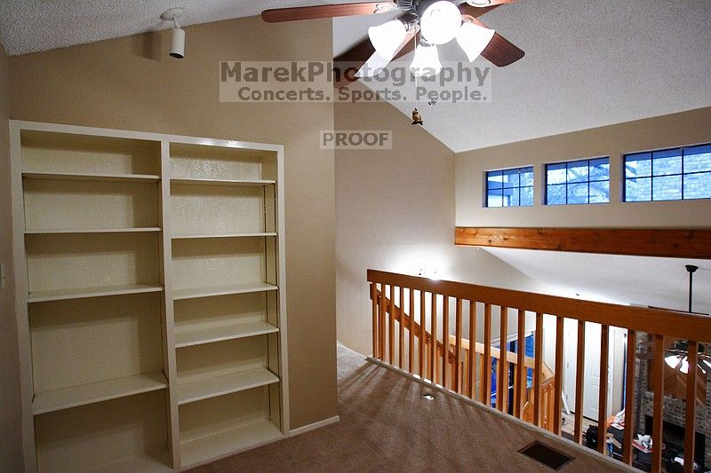 View of the loft with built in bookshelves.

Filename: SRM_20101228_17431543.JPG
Aperture: f/2.8
Shutter Speed: 1/40
Body: Canon EOS-1D Mark II
Lens: Canon EF 16-35mm f/2.8 L