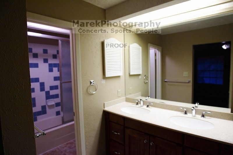 View of the double vanity in the master bath.

Filename: SRM_20101228_17494648.JPG
Aperture: f/2.8
Shutter Speed: 1/160
Body: Canon EOS-1D Mark II
Lens: Canon EF 16-35mm f/2.8 L
