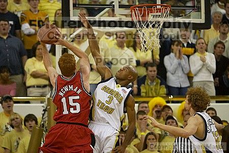 Jarrett Jack tries to block a shot at the UGA game.  Men's Basketball Georgia Tech beat UGA 87-49.

Filename: crw_5920_std.jpg
Aperture: f/2.8
Shutter Speed: 1/640
Body: Canon EOS DIGITAL REBEL
Lens: Canon EF 80-200mm f/2.8 L