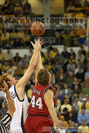 Luke Schenscher tipping off against UGA.  Men's Basketball Georgia Tech beat UGA 87-49.

Filename: crw_5913_std.jpg
Aperture: f/2.8
Shutter Speed: 1/640
Body: Canon EOS DIGITAL REBEL
Lens: Canon EF 80-200mm f/2.8 L