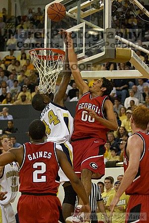 Theodis Tarver shoots against UGA.  Men's Basketball Georgia Tech beat UGA 87-49.

Filename: crw_5965_std.jpg
Aperture: f/2.8
Shutter Speed: 1/640
Body: Canon EOS DIGITAL REBEL
Lens: Canon EF 80-200mm f/2.8 L