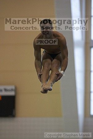 Diver Pete Doblar competes against the University of Tennessee.

Filename: crw_2175_std.jpg
Aperture: f/2.8
Shutter Speed: 1/1000
Body: Canon EOS DIGITAL REBEL
Lens: Canon EF 80-200mm f/2.8 L