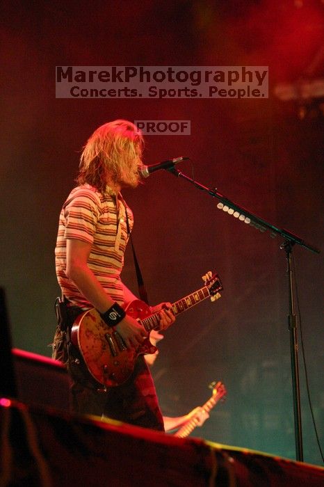 Puddle of Mudd performs on the 99X stage on the first day of Music Midtown, 2004.

Filename: IMG_6075.jpg
Aperture: f/2.8
Shutter Speed: 1/160
Body: Canon EOS DIGITAL REBEL
Lens: Canon EF 80-200mm f/2.8 L