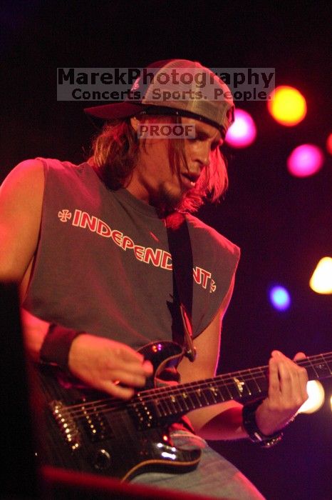 Puddle of Mudd performs on the 99X stage on the first day of Music Midtown, 2004.

Filename: IMG_6099.jpg
Aperture: f/2.8
Shutter Speed: 1/200
Body: Canon EOS DIGITAL REBEL
Lens: Canon EF 80-200mm f/2.8 L