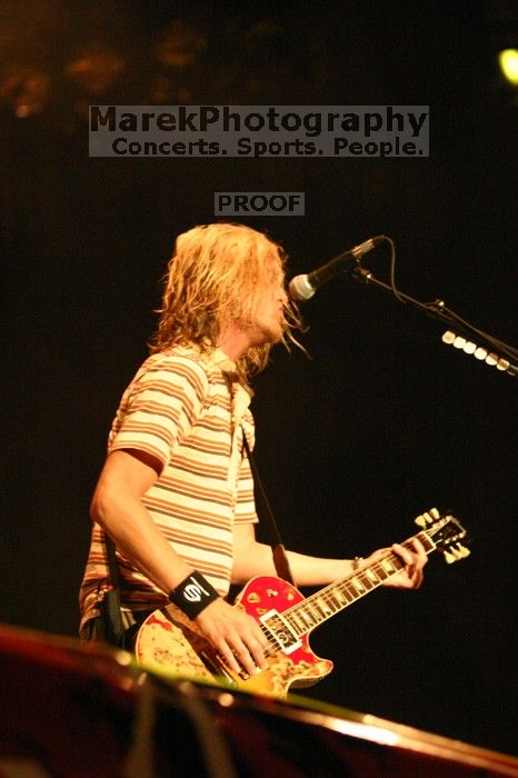 Puddle of Mudd performs on the first day of Music Midtown, 2004.

Filename: IMG_6047.jpg
Aperture: f/2.8
Shutter Speed: 1/160
Body: Canon EOS DIGITAL REBEL
Lens: Canon EF 80-200mm f/2.8 L
