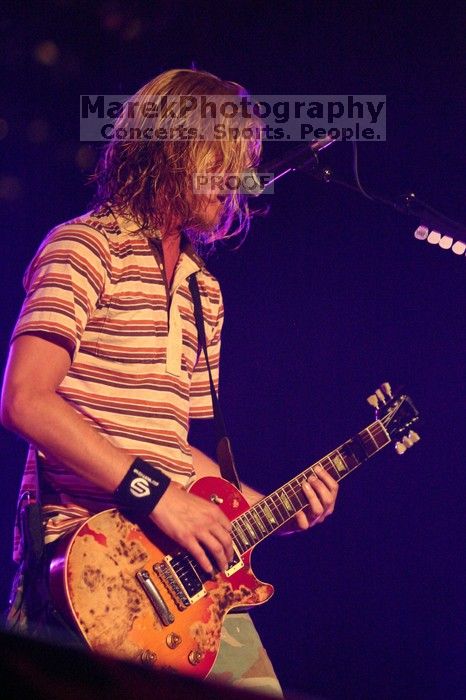 Puddle of Mudd performs on the 99X stage on the first day of Music Midtown, 2004.

Filename: IMG_6102.jpg
Aperture: f/2.8
Shutter Speed: 1/200
Body: Canon EOS DIGITAL REBEL
Lens: Canon EF 80-200mm f/2.8 L