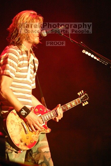 Puddle of Mudd performs on the 99X stage on the first day of Music Midtown, 2004.

Filename: IMG_6074.jpg
Aperture: f/2.8
Shutter Speed: 1/160
Body: Canon EOS DIGITAL REBEL
Lens: Canon EF 80-200mm f/2.8 L