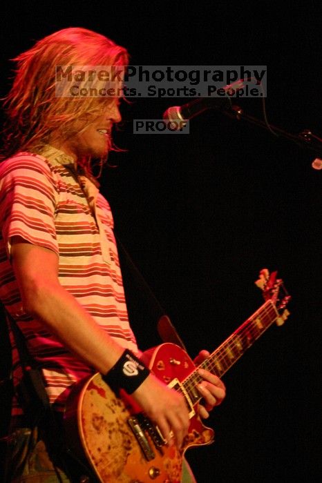 Puddle of Mudd performs on the first day of Music Midtown, 2004.

Filename: IMG_6059.jpg
Aperture: f/2.8
Shutter Speed: 1/160
Body: Canon EOS DIGITAL REBEL
Lens: Canon EF 80-200mm f/2.8 L