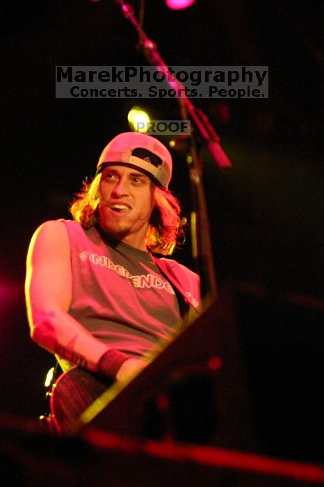 Puddle of Mudd performs on the first day of Music Midtown, 2004.

Filename: IMG_6057.jpg
Aperture: f/2.8
Shutter Speed: 1/160
Body: Canon EOS DIGITAL REBEL
Lens: Canon EF 80-200mm f/2.8 L