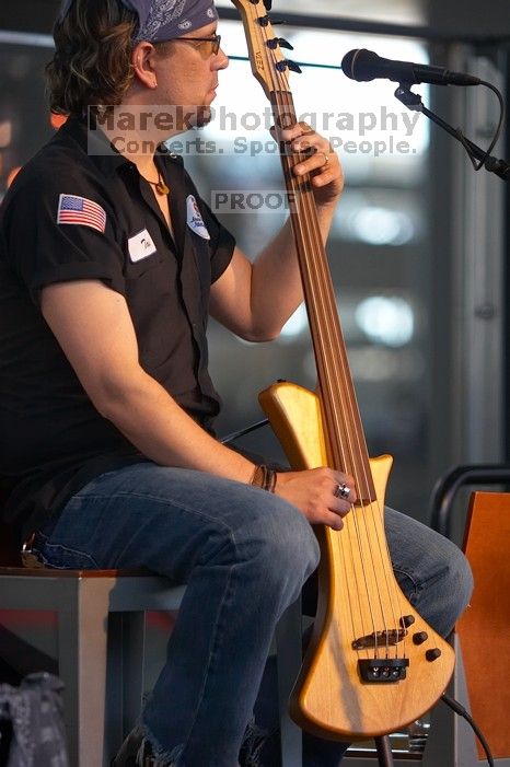 The Gene Pool, performing at the Austin airport.  Geno Stroia II on vocals/guitar, Jorge Castillo on vocals/guitar, Travis Woodard on drums and Steven Ray Will on vocals/bass guitar.

Filename: SRM_20060518_152256_9.jpg
Aperture: f/2.8
Shutter Speed: 1/200
Body: Canon EOS 20D
Lens: Canon EF 80-200mm f/2.8 L