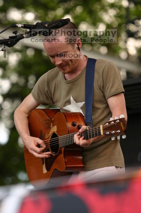 Damien Rice performs on the 99X stage on the second day of Music Midtown, 2004.

Filename: IMG_6327.jpg
Aperture: f/3.5
Shutter Speed: 1/320
Body: Canon EOS DIGITAL REBEL
Lens: Canon EF 80-200mm f/2.8 L