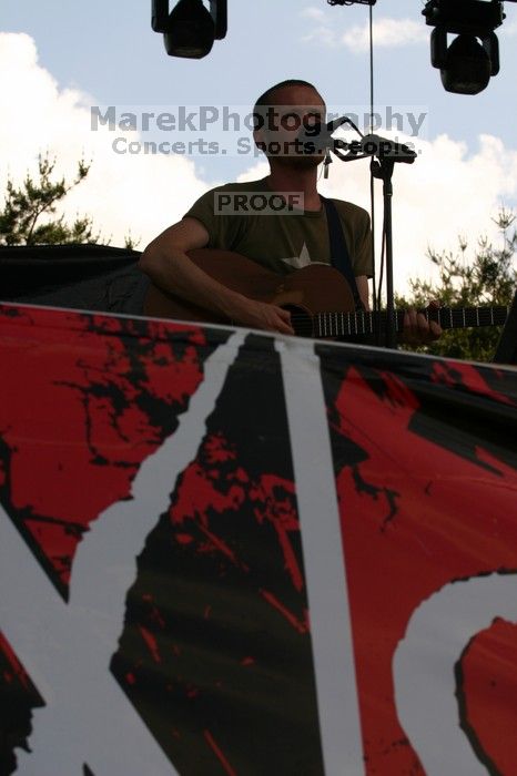 Damien Rice performs on the 99X stage on the second day of Music Midtown, 2004.

Filename: IMG_6312.jpg
Aperture: f/10.0
Shutter Speed: 1/320
Body: Canon EOS DIGITAL REBEL
Lens: Canon EF 80-200mm f/2.8 L