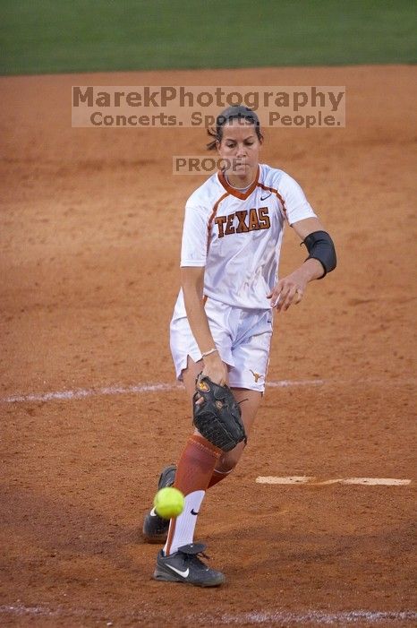 Cat Osterman pitching to the Mean Green.  The Lady Longhorns beat the University of North Texas 5-0 in the first game of the double header Wednesday night.

Filename: SRM_20060308_212228_8.jpg
Aperture: f/2.8
Shutter Speed: 1/1000
Body: Canon EOS 20D
Lens: Canon EF 80-200mm f/2.8 L