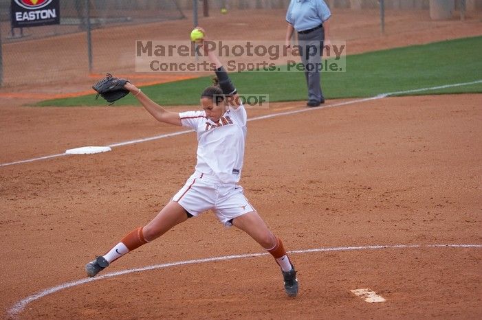 Cat Osterman pitching to the Mean Green.  The Lady Longhorns beat the University of North Texas 5-0 in the first game of the double header Wednesday night.

Filename: SRM_20060308_204301_1.jpg
Aperture: f/2.8
Shutter Speed: 1/1250
Body: Canon EOS 20D
Lens: Canon EF 80-200mm f/2.8 L