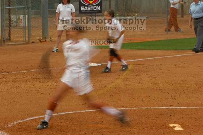 Cat Osterman pitching to the Mean Green.  The Lady Longhorns beat the University of North Texas 5-0 in the first game of the double header Wednesday night.

Filename: SRM_20060308_210011_0.jpg
Aperture: f/6.3
Shutter Speed: 1/20
Body: Canon EOS 20D
Lens: Canon EF 80-200mm f/2.8 L