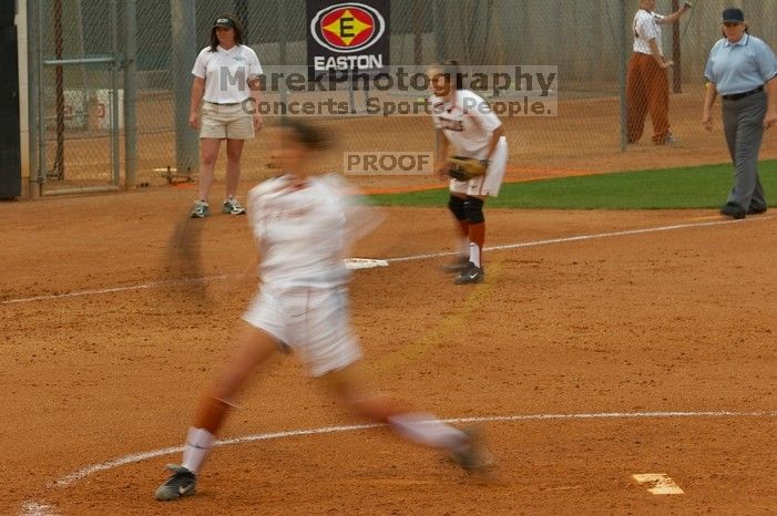 Cat Osterman pitching to the Mean Green.  The Lady Longhorns beat the University of North Texas 5-0 in the first game of the double header Wednesday night.

Filename: SRM_20060308_210027_1.jpg
Aperture: f/7.1
Shutter Speed: 1/20
Body: Canon EOS 20D
Lens: Canon EF 80-200mm f/2.8 L