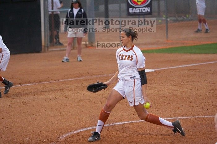 Cat Osterman pitching to the Mean Green.  The Lady Longhorns beat the University of North Texas 5-0 in the first game of the double header Wednesday night.

Filename: SRM_20060308_210531_0.jpg
Aperture: f/2.8
Shutter Speed: 1/1600
Body: Canon EOS 20D
Lens: Canon EF 80-200mm f/2.8 L