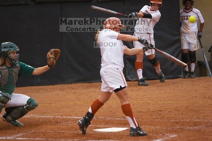 #4, MicKayla Padilla, bats against the Mean Green.  The Lady Longhorns beat the University of North Texas 5-0 in the first game of the double header Wednesday night.

Filename: SRM_20060308_210223_8.jpg
Aperture: f/2.8
Shutter Speed: 1/1600
Body: Canon EOS 20D
Lens: Canon EF 80-200mm f/2.8 L