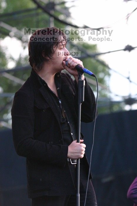 The Strokes perform on the 99X stage on the second day of Music Midtown, 2004.

Filename: IMG_6575.jpg
Aperture: f/3.5
Shutter Speed: 1/250
Body: Canon EOS DIGITAL REBEL
Lens: Canon EF 80-200mm f/2.8 L
