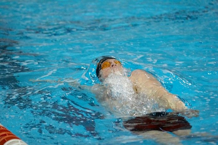 Matthew Lowe of the University of Texas Men's Varsity Swim Team placed 4th in the last heat of the 200 IM Prelims with a time of 1:50.11 at the Speedo American Short Course Championships.

Filename: SRM_20060304_105222_9.jpg
Aperture: f/2.8
Shutter Speed: 1/320
Body: Canon EOS 20D
Lens: Canon EF 80-200mm f/2.8 L