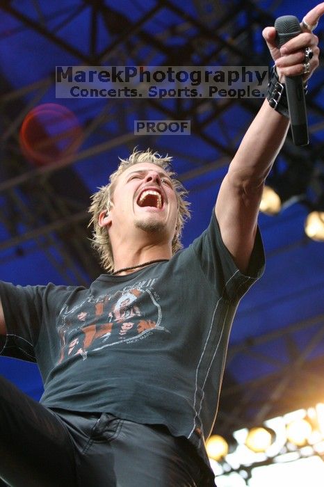 Fuel performs on the 99X stage on the third day of Music Midtown, 2004.

Filename: IMG_7108.jpg
Aperture: f/4.0
Shutter Speed: 1/250
Body: Canon EOS DIGITAL REBEL
Lens: Canon EF 80-200mm f/2.8 L