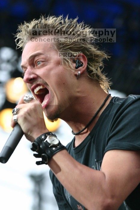 Fuel performs on the 99X stage on the third day of Music Midtown, 2004.

Filename: IMG_7126.jpg
Aperture: f/4.5
Shutter Speed: 1/250
Body: Canon EOS DIGITAL REBEL
Lens: Canon EF 80-200mm f/2.8 L