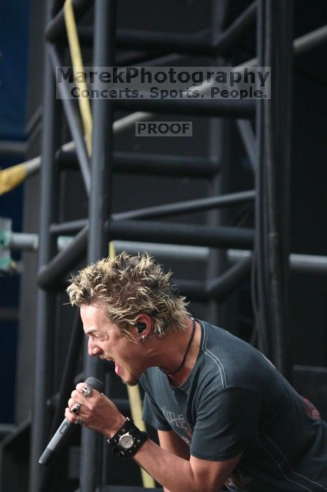 Fuel performs on the 99X stage on the third day of Music Midtown, 2004.

Filename: IMG_7141.jpg
Aperture: f/2.8
Shutter Speed: 1/320
Body: Canon EOS DIGITAL REBEL
Lens: Canon EF 80-200mm f/2.8 L