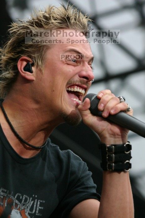 Fuel performs on the 99X stage on the third day of Music Midtown, 2004.

Filename: IMG_7117.jpg
Aperture: f/5.6
Shutter Speed: 1/250
Body: Canon EOS DIGITAL REBEL
Lens: Canon EF 80-200mm f/2.8 L
