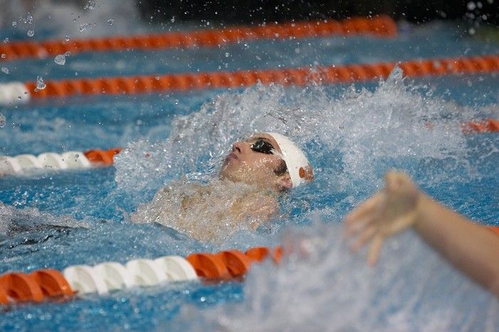 Garrett Weber Gale (Black Goggles) and Chris Seitz (Blue goggles) of the University of Texas Men's Varsity Swim Team placed 7th and 8th in the 6th heat of the 200 Backstroke Prelims with a time of 1:45.69 and 1:46.00 at the Speedo American Short Course Championships.

Filename: SRM_20060304_181506_2.jpg
Aperture: f/3.5
Shutter Speed: 1/640
Body: Canon EOS 20D
Lens: Canon EF 80-200mm f/2.8 L