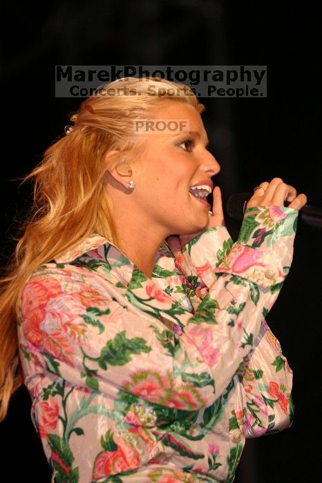 Jessica Simpson performs on the third day of Music Midtown, 2004.

Filename: IMG_7285.jpg
Aperture: f/2.8
Shutter Speed: 1/250
Body: Canon EOS DIGITAL REBEL
Lens: Canon EF 80-200mm f/2.8 L