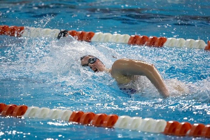 Kelsey Ditto of the Longhorn Aquatic swim team placed 1st in the last heat of the 1650 Freestyle Finals with a time of 16:05.39 at the Speedo American Short Course Championships.

Filename: SRM_20060304_184534_0.jpg
Aperture: f/2.8
Shutter Speed: 1/1000
Body: Canon EOS 20D
Lens: Canon EF 80-200mm f/2.8 L