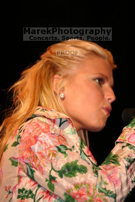 Jessica Simpson performs on the third day of Music Midtown, 2004.

Filename: IMG_7260.jpg
Aperture: f/2.8
Shutter Speed: 1/250
Body: Canon EOS DIGITAL REBEL
Lens: Canon EF 80-200mm f/2.8 L