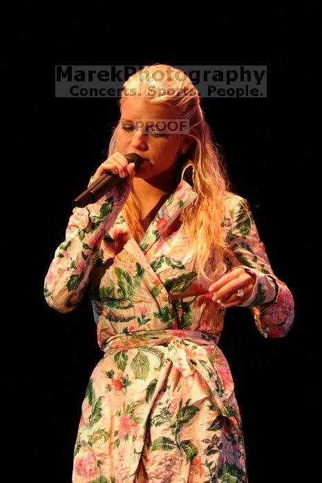 Jessica Simpson performs on the third day of Music Midtown, 2004.

Filename: IMG_7312.jpg
Aperture: f/2.8
Shutter Speed: 1/250
Body: Canon EOS DIGITAL REBEL
Lens: Canon EF 80-200mm f/2.8 L