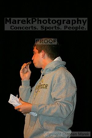 Cookie Eating contest in between acts at the Mock Rock competition at the Ferst Center.  The male student in gray and the female student in navy blue were the winners.                                                                                        

Filename: img_1769_std.jpg
Aperture: f/2.8
Shutter Speed: 1/160
Body: Canon EOS DIGITAL REBEL
Lens: Canon EF 80-200mm f/2.8 L