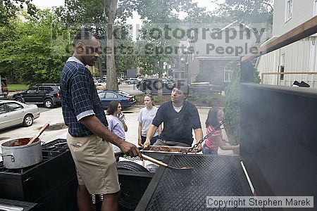 Coach Paul Hewitt and Jimmy Mitchell grill hamburgers at AXO Thursday night.  AXO was the winning sorority for the basketball attendance competition.

Filename: crw_0053_std.jpg
Aperture: f/6.3
Shutter Speed: 1/80
Body: Canon EOS DIGITAL REBEL
Lens: Sigma 15-30mm f/3.5-4.5 EX Aspherical DG DF