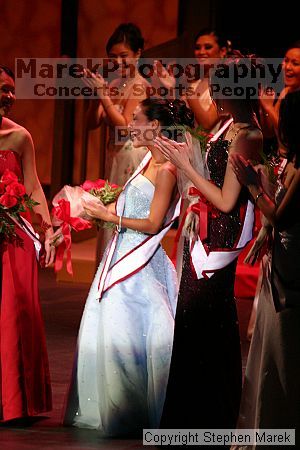 Miss Asian Atlanta pageant, 2004.

Filename: img_0963_std.jpg
Aperture: f/2.8
Shutter Speed: 1/160
Body: Canon EOS DIGITAL REBEL
Lens: Canon EF 80-200mm f/2.8 L