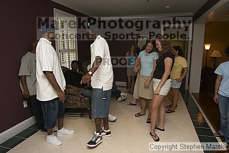 Coach Paul Hewitt grilled hamburgers at AXO Thursday night.  AXO was the winning sorority for the basketball attendance competition.

Filename: crw_0084_std.jpg
Aperture: f/4.5
Shutter Speed: 1/60
Body: Canon EOS DIGITAL REBEL
Lens: Sigma 15-30mm f/3.5-4.5 EX Aspherical DG DF