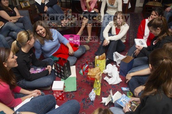 Kathlyn Parr, Christy Carr, Meredith Clonch, Beth Leeker, Reem Hafez, Megan Watson and Ashley Marz (from left) opening gifts at the Alpha Delta Pi Christmas party, Sunday, December 10, 2006.

Filename: SRM_20061210_1903421.jpg
Aperture: f/7.1
Shutter Speed: 1/100
Body: Canon EOS 20D
Lens: Canon EF-S 18-55mm f/3.5-5.6
