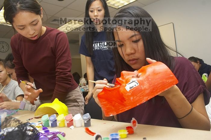Emily Ng, right, decorates her mask next to Vivian Mai-Tran, left, at a domestic violence expressive arts workshop for survivors and friends of survivors of domestic and relationship violence.
Filename: SRM_20061023_1739087.jpg
Aperture: f/5.6
Shutter Speed: 1/100
Body: Canon EOS 20D
Lens: Canon EF-S 18-55mm f/3.5-5.6