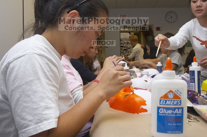 Hannah Yee painting her mask at a domestic violence expressive arts workshop for survivors and friends of survivors of domestic and relationship violence.
Filename: SRM_20061023_1741041.jpg
Aperture: f/5.6
Shutter Speed: 1/100
Body: Canon EOS 20D
Lens: Canon EF-S 18-55mm f/3.5-5.6