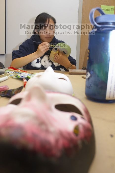 Stephanie Luu, with Hannah Jones' mask in the foreground. Domestic violence expressive arts workshop for survivors and friends of survivors of domestic and relationship violence.
Filename: SRM_20061023_1800547.jpg
Aperture: f/5.6
Shutter Speed: 1/100
Body: Canon EOS 20D
Lens: Canon EF-S 18-55mm f/3.5-5.6