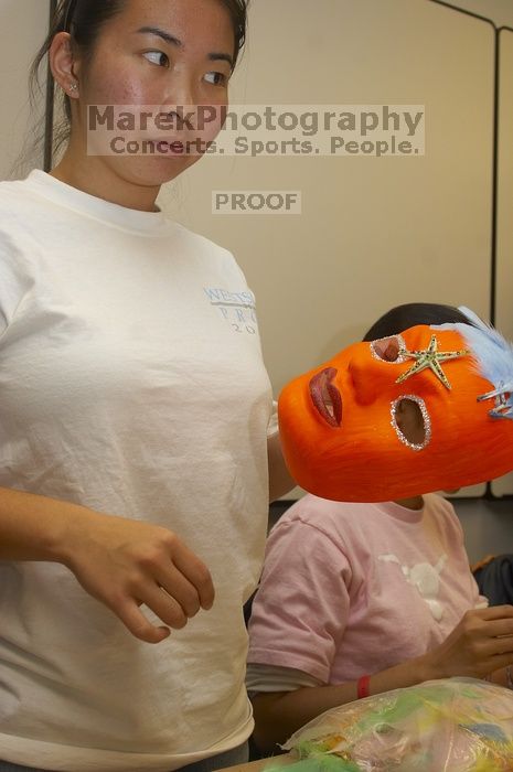 Hannah Yee painting her mask at a domestic violence expressive arts workshop for survivors and friends of survivors of domestic and relationship violence.
Filename: SRM_20061023_1806207.jpg
Aperture: f/5.6
Shutter Speed: 1/100
Body: Canon EOS 20D
Lens: Canon EF-S 18-55mm f/3.5-5.6