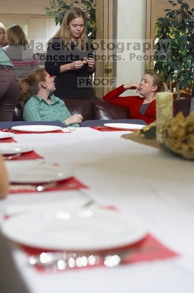 Veronica Hamlet, Carol Gosset, and Rachel Bryant, from left, at the Alpha Xi Delta Christmas dinner, Friday, December 4, 2006.

Filename: SRM_20061204_1751321.jpg
Aperture: f/2.8
Shutter Speed: 1/25
Body: Canon EOS-1D Mark II
Lens: Canon EF 50mm f/1.8 II