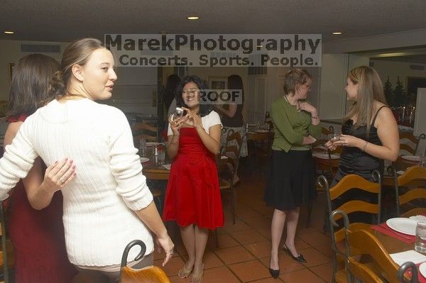 Alina Rizbia takes a photo of Madi Houston and unknown at the Alpha Xi Delta Christmas dinner, Friday, December 4, 2006.
Filename: SRM_20061204_1753046.jpg
Aperture: f/6.3
Shutter Speed: 1/250
Body: Canon EOS 20D
Lens: Canon EF-S 18-55mm f/3.5-5.6