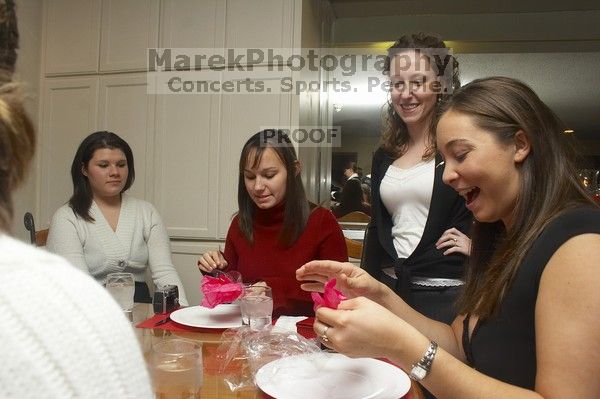 Mandy Mauldin, center, gives presents to Jessica Schreyer, left, and Allison Leah, right, at the Alpha Xi Delta Christmas dinner, Friday, December 4, 2006.
Filename: SRM_20061204_1815222.jpg
Aperture: f/6.3
Shutter Speed: 1/250
Body: Canon EOS 20D
Lens: Canon EF-S 18-55mm f/3.5-5.6