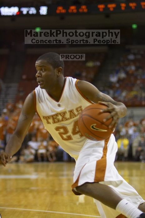 Guard Justin Mason, #24.  The longhorns defeated the Texas Southern University (TSU) Tigers 90-50 Saturday night.

Filename: SRM_20061128_1926543.jpg
Aperture: f/2.8
Shutter Speed: 1/640
Body: Canon EOS-1D Mark II
Lens: Canon EF 80-200mm f/2.8 L