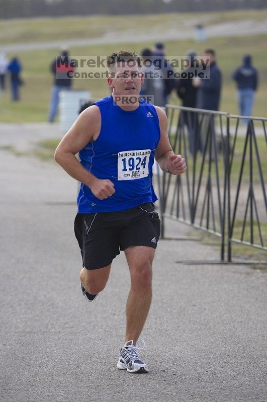James Rogers, 1:31:05, running the Decker Challenge 20K 2006 road race.

Filename: SRM_20061203_0934481.jpg
Aperture: f/4.0
Shutter Speed: 1/500
Body: Canon EOS-1D Mark II
Lens: Canon EF 80-200mm f/2.8 L