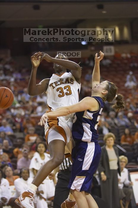 Forward Tiffany Jackson, #33.  The lady longhorns defeated the Oral Roberts University's (ORU) Golden Eagles 79-40 Saturday night.

Filename: SRM_20061125_1329120.jpg
Aperture: f/2.8
Shutter Speed: 1/400
Body: Canon EOS-1D Mark II
Lens: Canon EF 80-200mm f/2.8 L