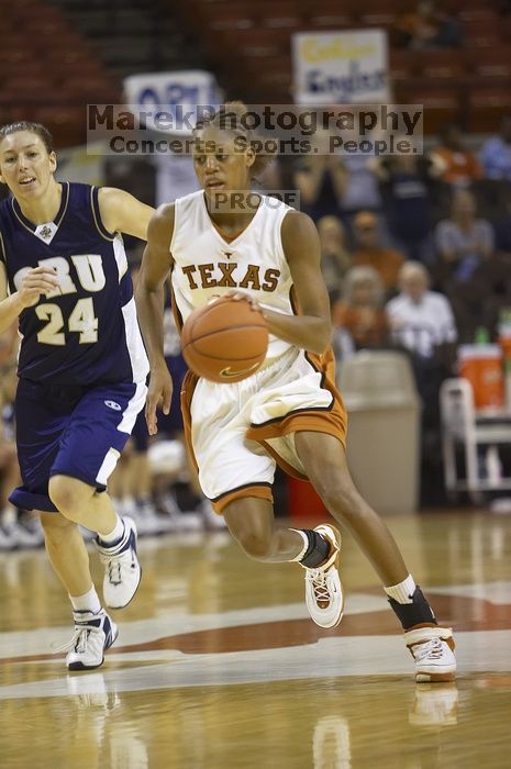Guard Brittainey Raven, #10. The lady longhorns defeated the Oral Roberts University's (ORU) Golden Eagles 79-40 Saturday night.
Filename: SRM_20061125_1357268.jpg
Aperture: f/2.8
Shutter Speed: 1/400
Body: Canon EOS-1D Mark II
Lens: Canon EF 80-200mm f/2.8 L