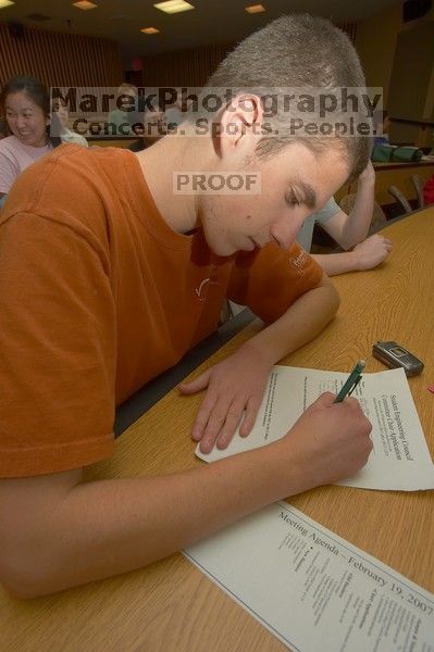 Sagi Zisman filling out an application at the Engineering Council meeting, Monday, February 19, 2007.

Filename: SRM_20070219_1904385.jpg
Aperture: f/8.0
Shutter Speed: 1/100
Body: Canon EOS-1D Mark II
Lens: Sigma 15-30mm f/3.5-4.5 EX Aspherical DG DF